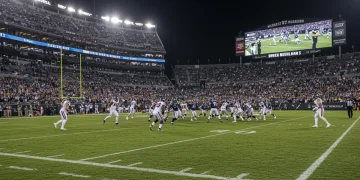 NFL Week 1 upset, underdog team celebrating, shocked crowd, unexpected football game result