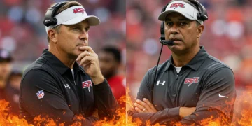 Two USFL head coaches under pressure on the sidelines, with fiery graphics symbolizing the coaching hot seat ahead of the 2025 season.