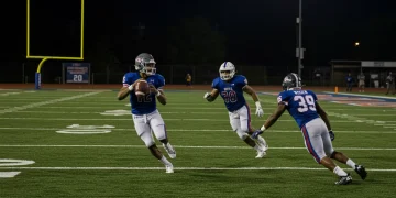 USFL football player making a strategic pass on a lit field, symbolizing rule change impacts.