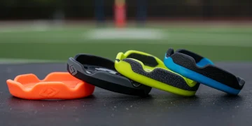 Four new youth football mouthguards from 2026, showcasing advanced protective features.