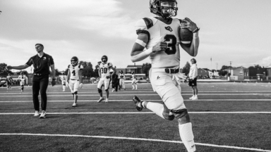 High school football news and player development stories